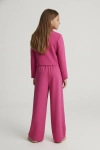 A_young_girl_standing_with_her_back_completely_fac-1779348086578.png